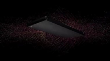 Cep telefonu renkli bir arkaplanda döner ve içindeki ekran yeşildir..