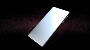 Cep telefonu renkli bir arkaplanda döner ve içindeki ekran yeşildir..