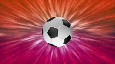 Futbol topunun sembolleri renkli bir arkaplanda dönüyor.