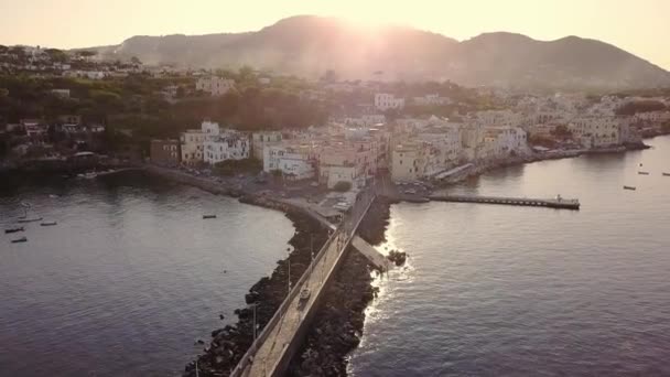 Bridge connects Ischia Island surrounded by sea in morning — стоковое видео