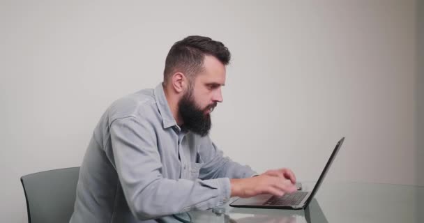 Man Types Keyboard Feeling Irritated Laptop Lagging Work Bearded Freelancer — Stockvideo