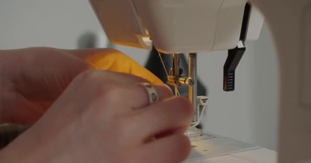 Woman Prepares Sewing Machine Work Sitting Table Blurred Background Professional — Αρχείο Βίντεο
