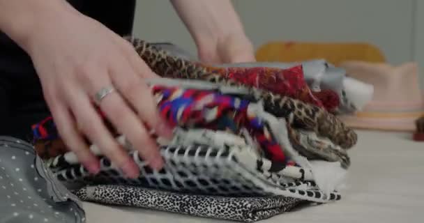 Woman Puts Stack Cloth Bright Patterns White Table Professional Milliner — Wideo stockowe