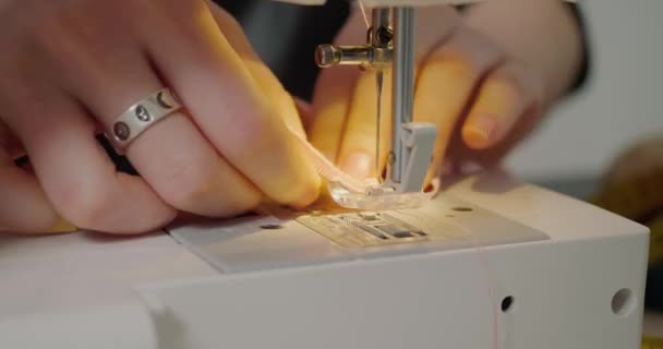 Woman Sews Wide Colorful Ribbon Using Sewing Machine Table Professional — Stock Video