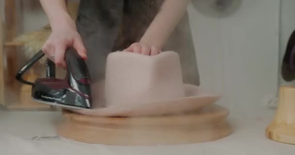 Woman Steams Felt Hat Brim Iron Wooden Mold Table Workshop — Vídeos de Stock