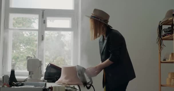 Blonde Woman Steams Felt Hat Body Iron Turning Mold Table — Vídeos de Stock
