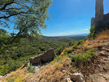 A sunny scenic on of the rude, dry Mediterranean landscape from the ruins of the ancient Templar castle at Allegre-les- fumades, Gard