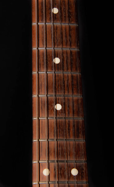 Close up shot of wooden guitar part