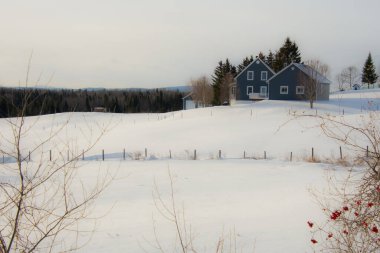 Farm barn in village during winter
