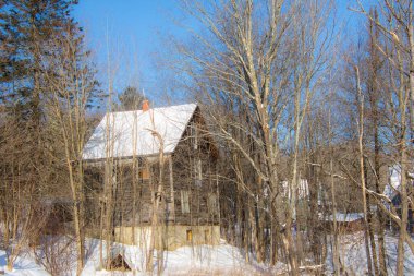 Old house in winter village 