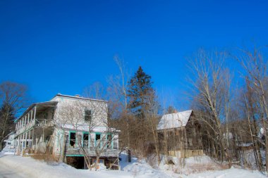 Old house in winter village 