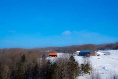 Farm barn in village during winter