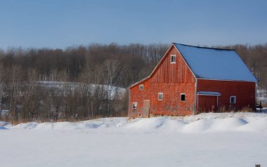 Farm barn in village during winter