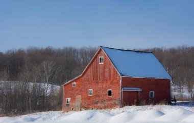 Farm barn in village during winter