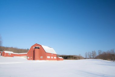 Farm barn in village during winter