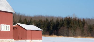 Farm barn in village during winter