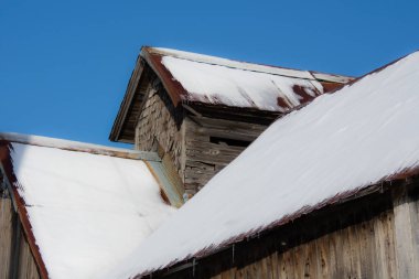 Farm barn in village during winter