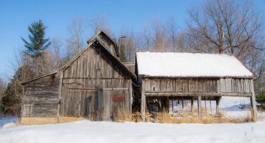 Farm barn in village during winter