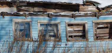 Old house in winter village 
