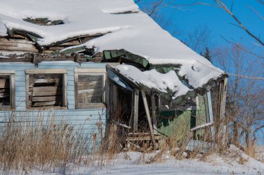 Old house in winter village 