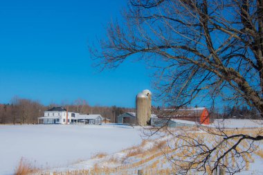Farm barn in village during winter