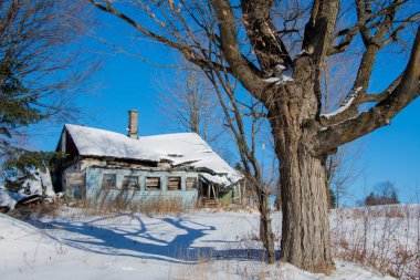 Old house in winter village 
