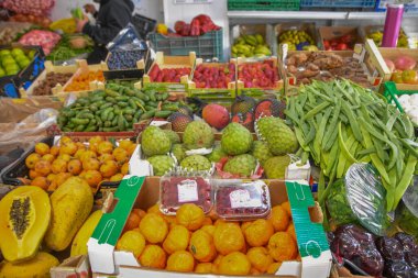 closeup of fruits and vegetables stalls at local market in Spain