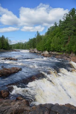 Waterfalls on a beautiful wild river in Quebec, Canada