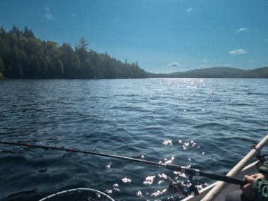 man fishing on river in the province of Quebec, Canada