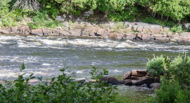 Waterfalls on a beautiful wild river in Quebec, Canada