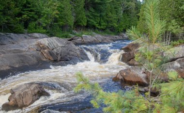 Waterfalls on a beautiful wild river in Quebec, Canada