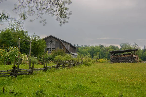 Old barn on a farm in the canadian countryside in Quebec