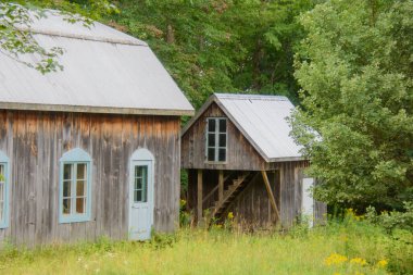 Old barn on a farm in the canadian countryside in Quebec