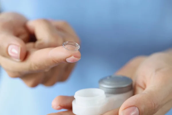 Soft contact lens on finger and storage box closeup — Stock Photo, Image