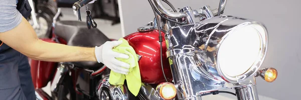 Man cleaning motorcycle in service center closeup — Stock Photo, Image