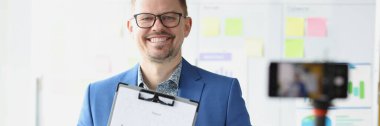 Male mentor conducts online business development training