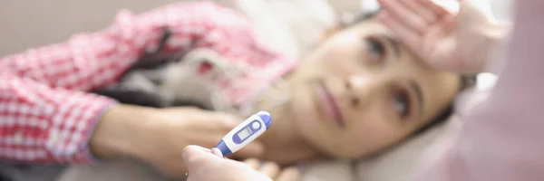 Young woman lying on bed had fever and chills closeup — Stock Photo, Image