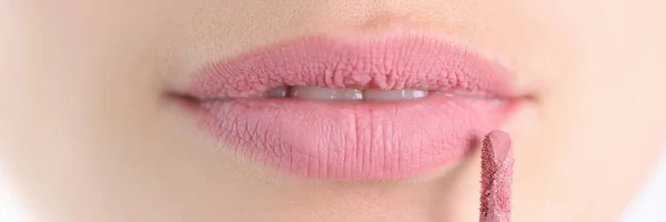 Painted female lips with lipstick brush closeup — Stock Photo, Image