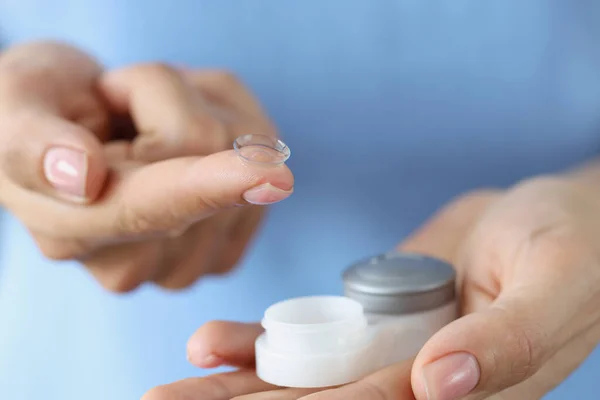 Contact lenses for vision and a container in female hands, blurry — Stock Photo, Image