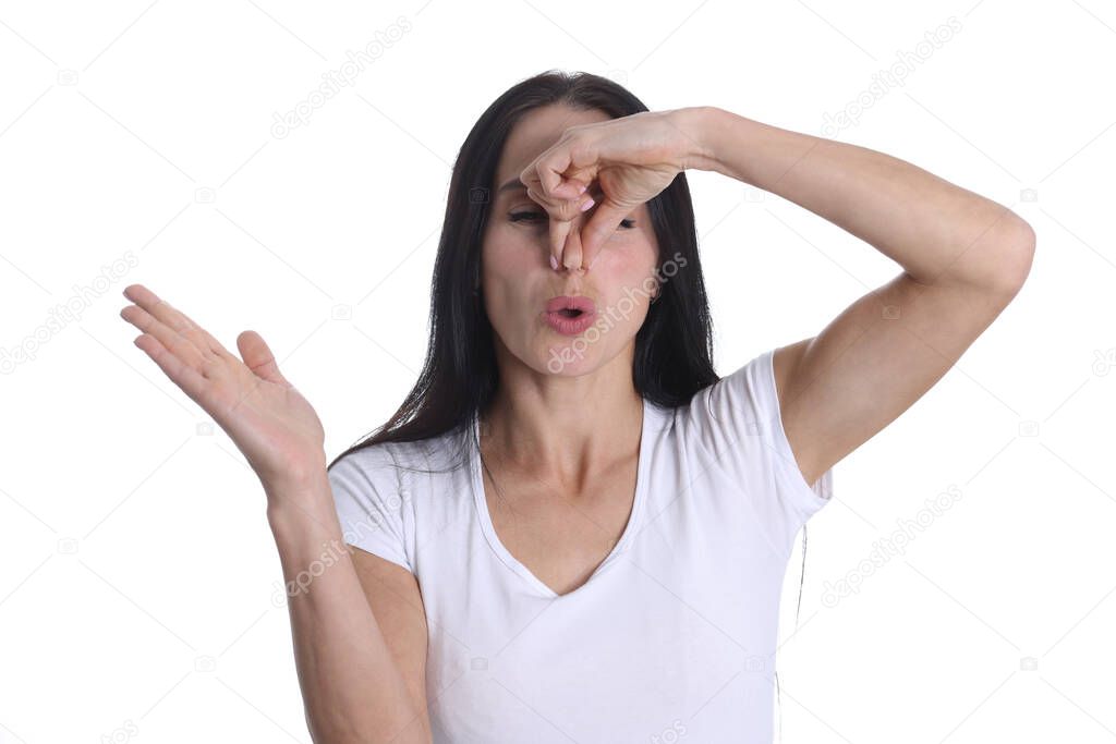 Woman closes nose from bad smelly smell