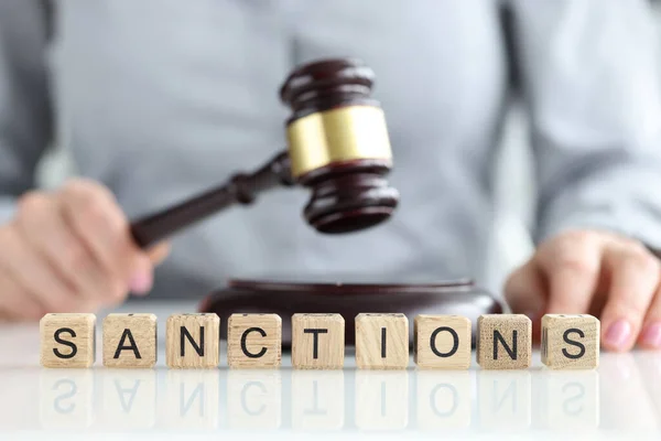 International sanctions and judge with gavel in courtroom — Stock Photo, Image