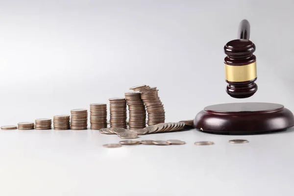 Judicial gavel and stacks of coins and financial crimes — Stock Photo, Image