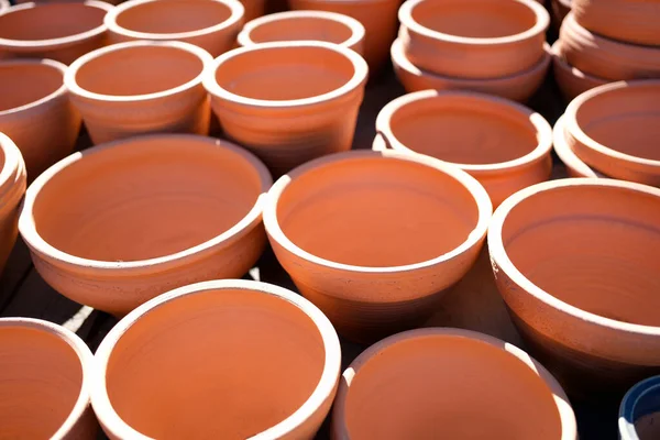 Lot of clay pots for sale on street background closeup — Foto de Stock