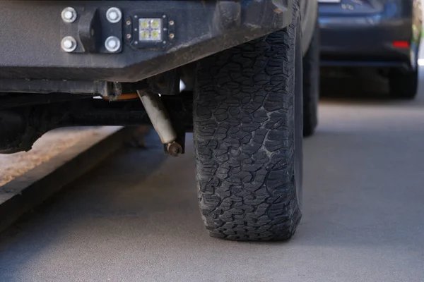 Car is incorrectly parked with wheel on pavement closeup — Stock Photo, Image