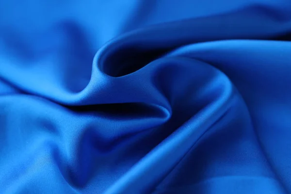 Blå satin tyg närbild. Naturligt tyg eller polyester satin koncept — Stockfoto