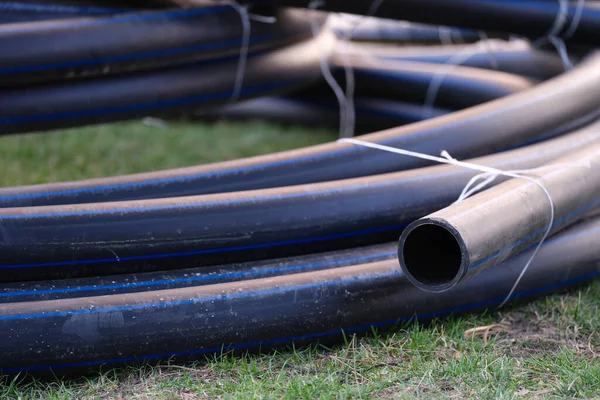 Plastic pipes for underground water supply and sewerage closeup — Foto de Stock