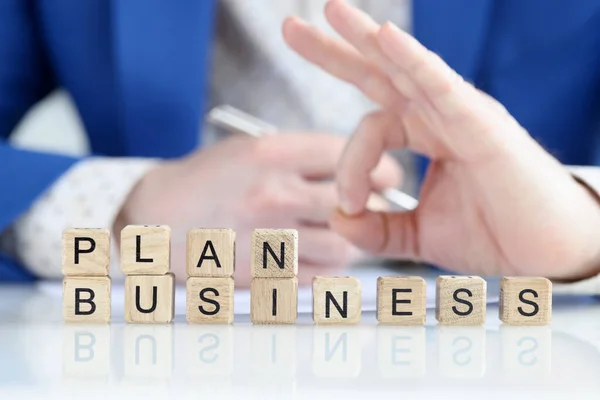 Business plan text and businessman hand with ok gesture — Stock Photo, Image