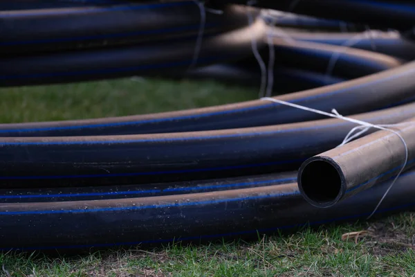 Large black plastic pipes for water supply closeup — Foto de Stock