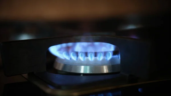 Cooking gas stove fire and electric stove closeup