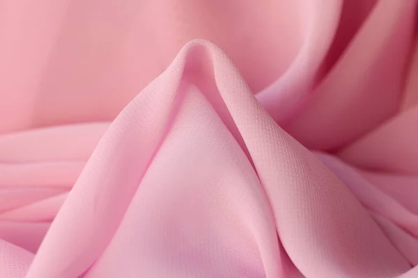 Cotton synthetic fabric in soft pink color. Fabric background